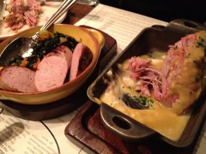 Milk braised pork shoulder (right) and house-made veal sausage (left).