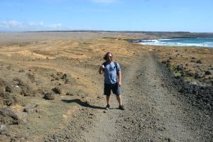 Ryan on the road to the green sand beach.